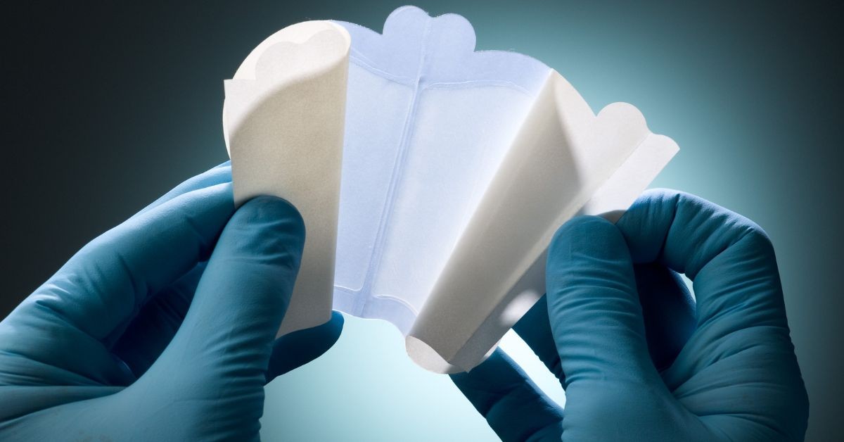 Understanding How Hydrocolloid Patches Work, blue gloves showing flexible wound care patch.